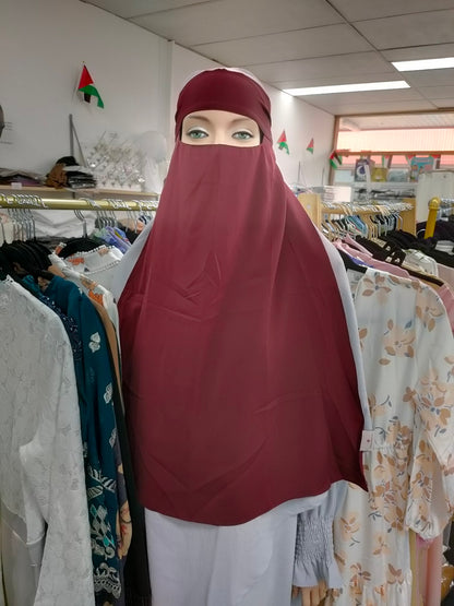 Discover the captivating allure of the Hikmah Boutique Single Layer Niqab in Maroon. This finely tailored niqab embodies the essence of modest clothing, offering both coverage and comfort in a design that exudes timeless sophistication.
