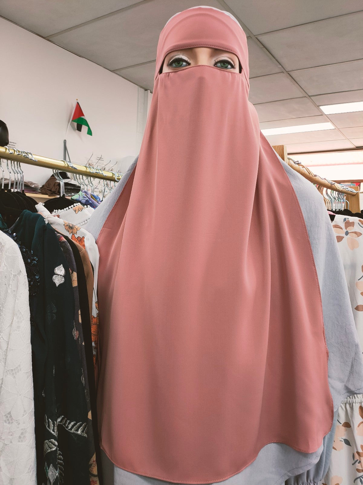 Experience the enchanting charm of the Hikmah Boutique Single Layer Niqab in Pink, perfect for special occasions and everyday wear alike. Crafted with precision, this niqab offers a comfortable fit and breathability, making it suitable for all seasons and climates.