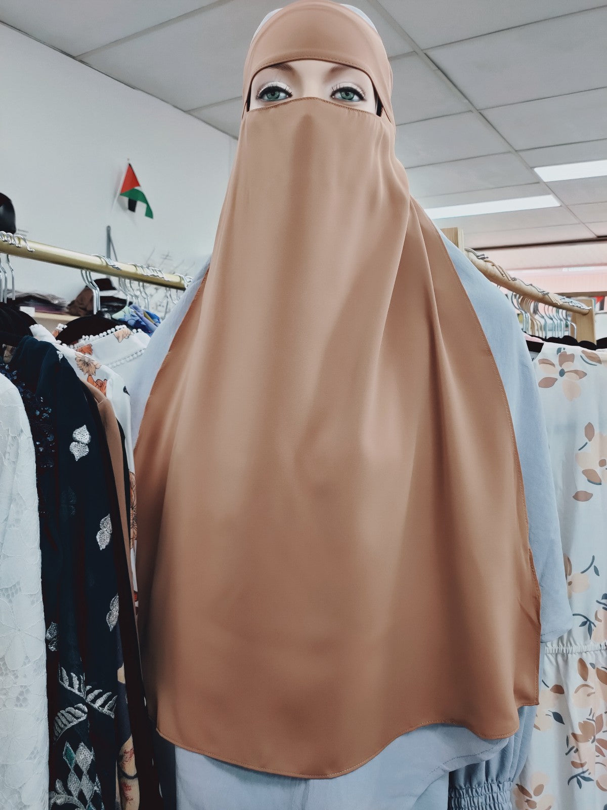 Experience the timeless elegance of the Hikmah Boutique Single Layer Niqab in Teak Tan, an essential piece of modest clothing for every occasion. Meticulously crafted with premium materials, this niqab offers both coverage and comfort, reflecting the essence of Muslim clothing and Islamic clothing.