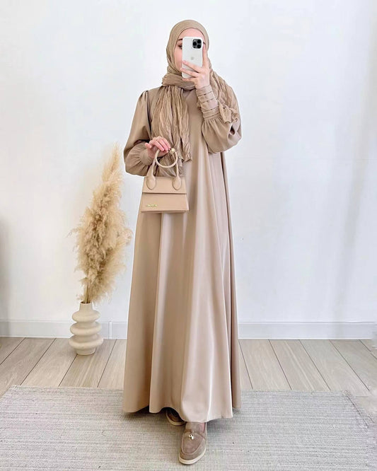 Discover the Occasion Elegance Satin Abaya in Golden Beige at Hikmah Boutique Australia. Perfect for elegant occasions, this luxurious abaya is available online. Shop now!