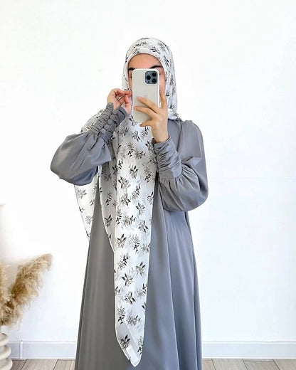 Shop the Occasion Elegance Satin Abaya in Pearl Grey at Hikmah Boutique Australia. This luxurious and elegant abaya is perfect for special occasions. Buy online today!