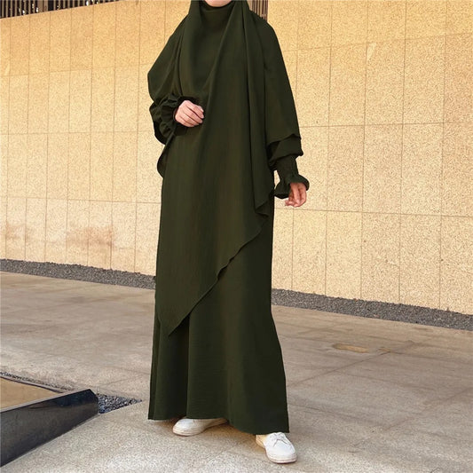 Shop Modest Clothing with our Olive Green Crepe Crinkle Abaya with Double Layer Khimar Set – Exclusive Modesty at Hikmah Boutique Elevate your wardrobe with the understated elegance of our Olive Green Crepe Crinkle Abaya with Double Layer Khimar Set, a timeless modesty available at Hikmah Boutique.