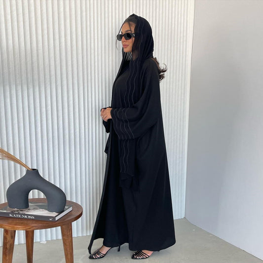 Experience timeless elegance with our Black Open Abaya with Matching Embroidered Hijab. This Modest Abaya is perfect for any occasion. Shop now at Hikmah Boutique, your go-to destination for modest fashion in Australia.