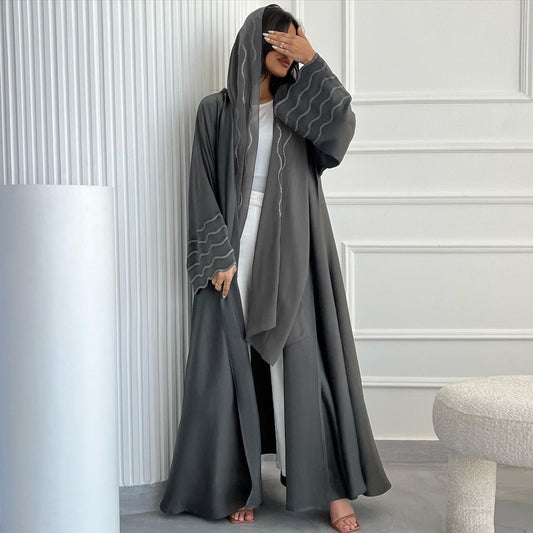 Grey Open Abaya with Matching Embroidered Hijab. This sophisticated modest abaya features delicate embroidery and a flowing silhouette, perfect for any occasion. Shop now at Hikmah Boutique, your go-to destination for modest fashion in Australia.