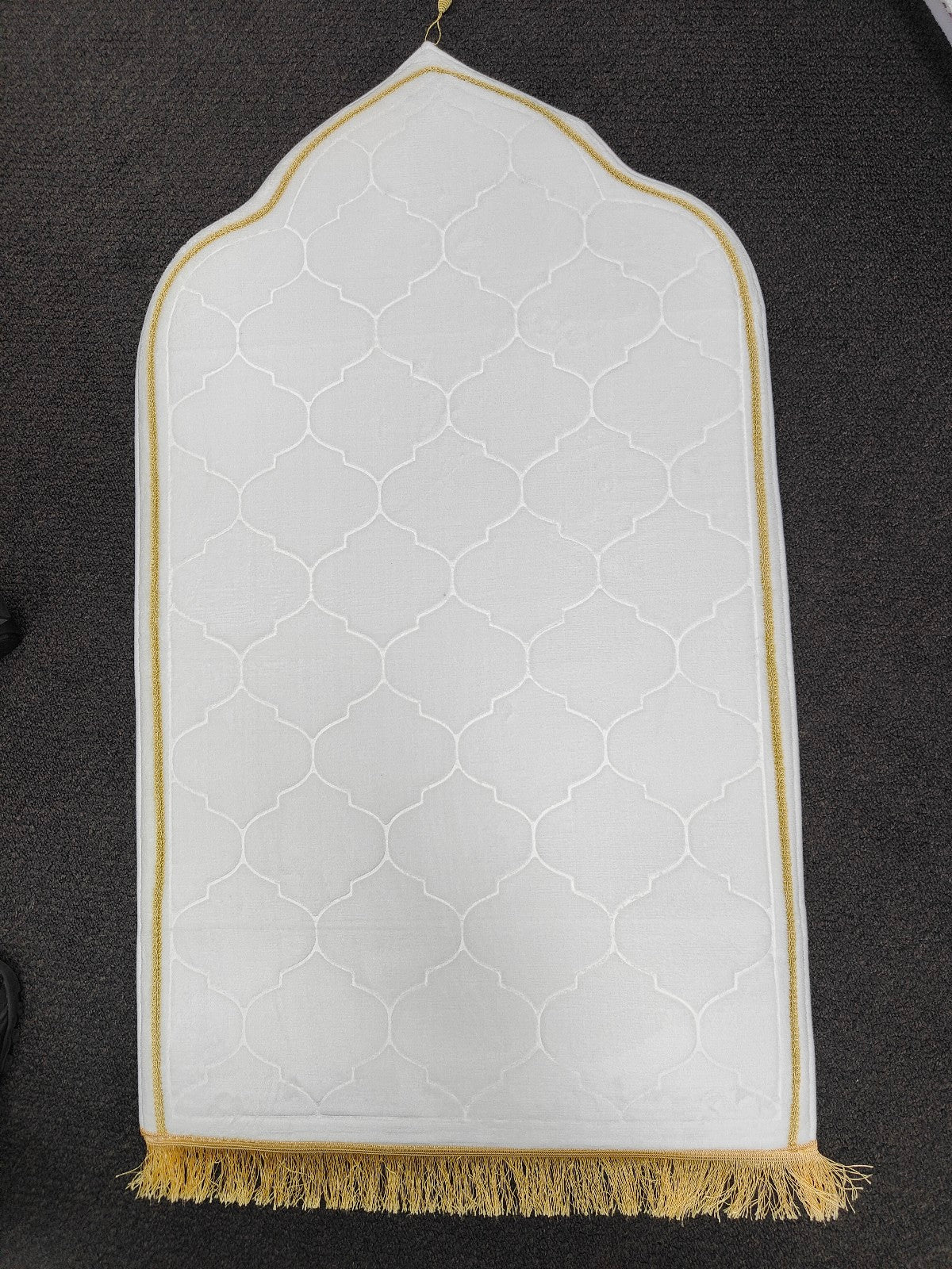 Experience divine comfort with our Premium Padded Prayer Mat in White, exclusively available at Hikmah Boutique. Crafted to enhance your prayer experience, this soft and comfortable Islamic Prayer Mat ensures your moments of devotion are serene and tranquil. Perfect for adults seeking a luxurious and cushioned prayer rug.