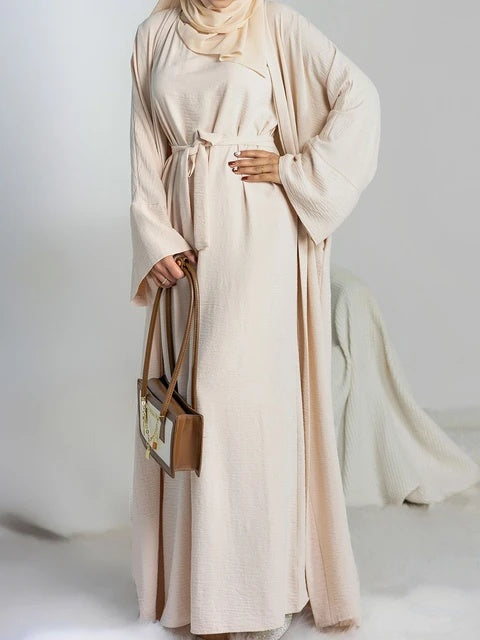 Elevate your modest wardrobe with our stunning Plain Abaya 3-piece set in classic Beige, exclusively offered by Hikmah Boutique. Crafted with meticulous attention to detail, each piece in this ensemble is made from premium crepe fabric, ensuring comfort and a graceful drape that flatters modest clothing silhouette.