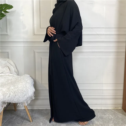 Introducing our exquisite Plain Abaya 3-piece set in classic Black, exclusively available at Hikmah Boutique. Crafted with precision from premium crepe fabric, this Plain Abaya epitomizes luxury and comfort, ensuring a graceful drape and elegant modest clothing silhouette.
