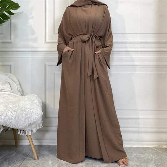 Elevate your modest wardrobe with our exquisite Plain Abaya 3-piece set in rich Chocolate Brown, exclusively offered by Hikmah Boutique. Each piece in this ensemble is meticulously crafted from premium crepe fabric, ensuring luxurious comfort and a graceful drape that flatters modest clothing silhouette. 