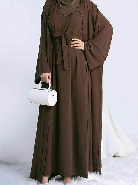 Step into the epitome of modest elegance with our exclusive Plain Abaya 3-piece set in Dark Coffee, brought to you by Hikmah Boutique. Crafted with meticulous attention to detail, each piece in this ensemble is tailored from premium crepe fabric, ensuring a luxurious feel and a graceful modest clothing silhouette.
