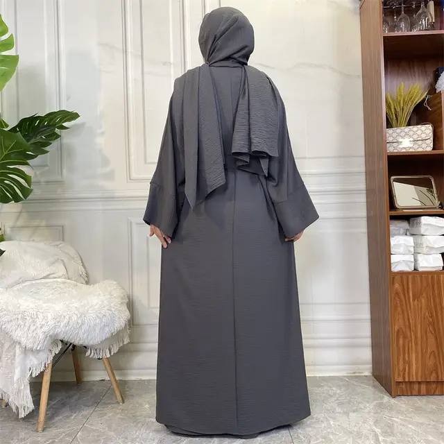 Elevate your modest wardrobe with our exclusive Plain Abaya 3-piece set in Dark Grey, meticulously crafted by Hikmah Boutique. Made from premium crepe fabric, this ensemble epitomizes luxury and comfort, promising a graceful drape and timeless modest clothing style.