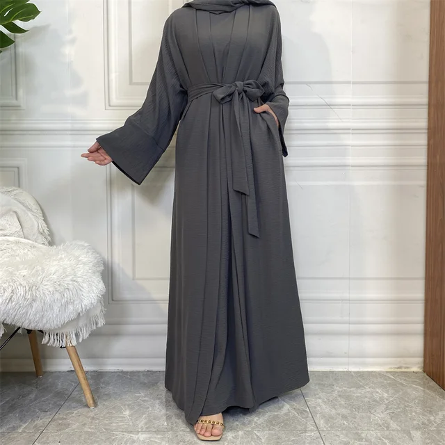 Elevate your modest wardrobe with our exclusive Plain Abaya 3-piece set in Dark Grey, meticulously crafted by Hikmah Boutique. Made from premium crepe fabric, this ensemble epitomizes luxury and comfort, promising a graceful drape and timeless modest clothing style.