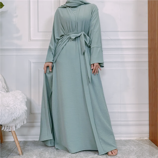 Elevate your modest wardrobe with our exquisite Plain Abaya 3 Piece Set in enchanting Dusty Green, available exclusively at Hikmah Boutique. Crafted with utmost care and precision, each piece in this ensemble exudes sophistication and grace, making it the perfect choice for discerning modest clothing enthusiasts.