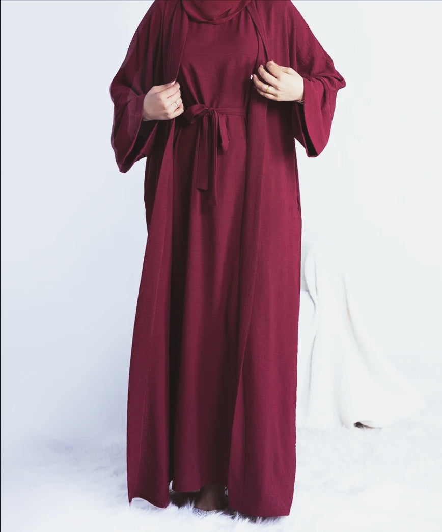 Elevate your modest wardrobe with our exquisite Plain Abaya 3 Piece Set in rich Maroon, exclusively available at Hikmah Boutique. Crafted with utmost care and precision, each piece in this ensemble exudes sophistication and grace, making it the perfect choice for discerning modest clothing enthusiasts.