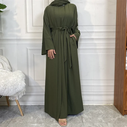 Step into sophistication with our Olive Green Plain Abaya 3 Piece Set, a stunning addition exclusively available at Hikmah Boutique. Each meticulously crafted piece in this ensemble embodies timeless elegance, catering to the discerning tastes of modest clothing enthusiasts.
