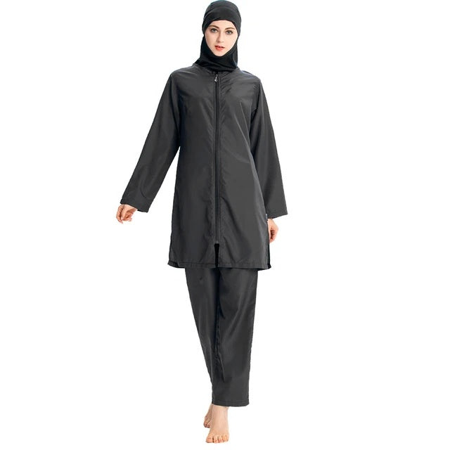 Shop the Women’s Plain Black Burkini Modest Swimwear Set at Hikmah Boutique. Full coverage 3-piece design, premium quality, available in all sizes. Order now for fast shipping.