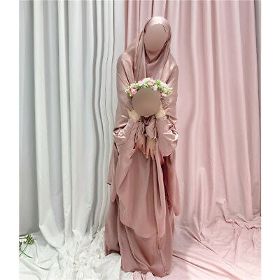 Hikmah Boutique presents Girls Prayer Jilbab, the perfect addition to your little girl's prayer wardrobe. Made with care and attention to detail, this two-piece jilbab features a beautiful light pink color that is sure to delight your young one. The jilbab is designed with a skirt that has a comfortable elastic waistband.