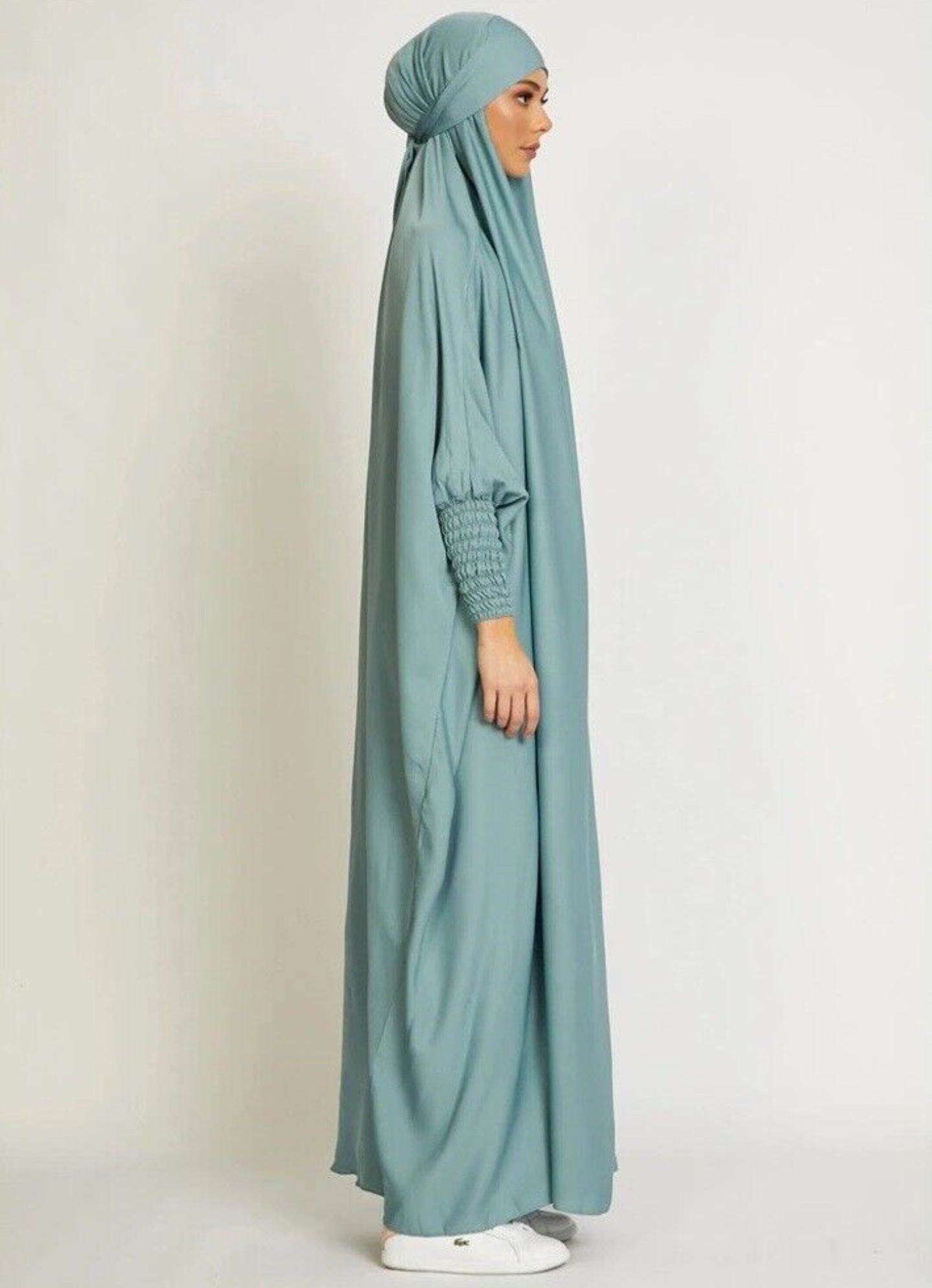 Dive into serenity with our Aqua Pearl One Piece Tie-Up Jilbab. Immerse yourself in the tranquil hues of aqua, combining modesty and style. Explore our exclusive satin Jilbab at Hikmah Boutique for unique and affordable prayer Jilbab.