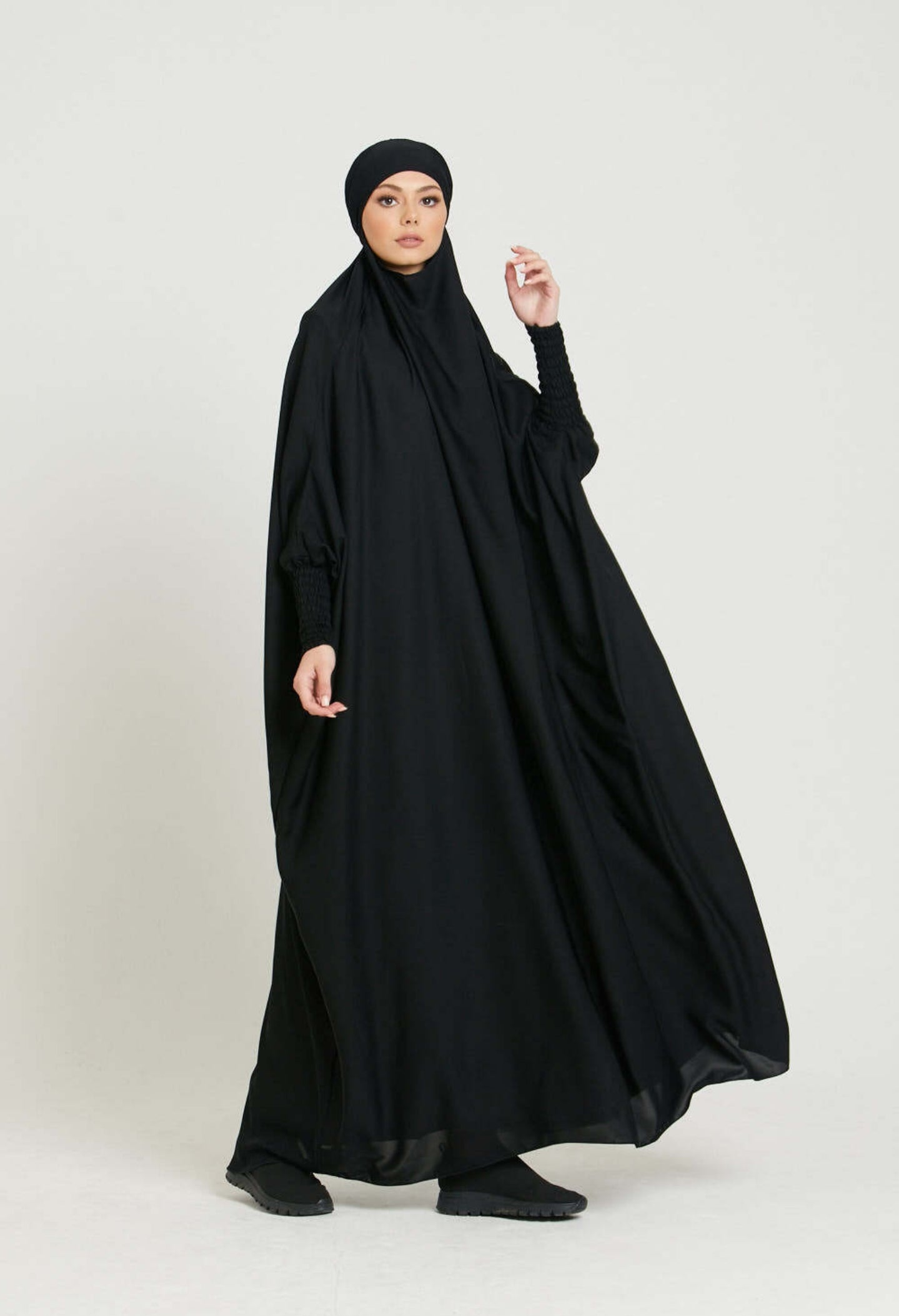 Step into timeless sophistication with our Black One Piece Tie-Up Jilbab. Meticulously crafted for confident praying Salah, this Islamic garment combines enduring modesty with chic style. Find your perfect prayer companion at Hikmah Boutique.