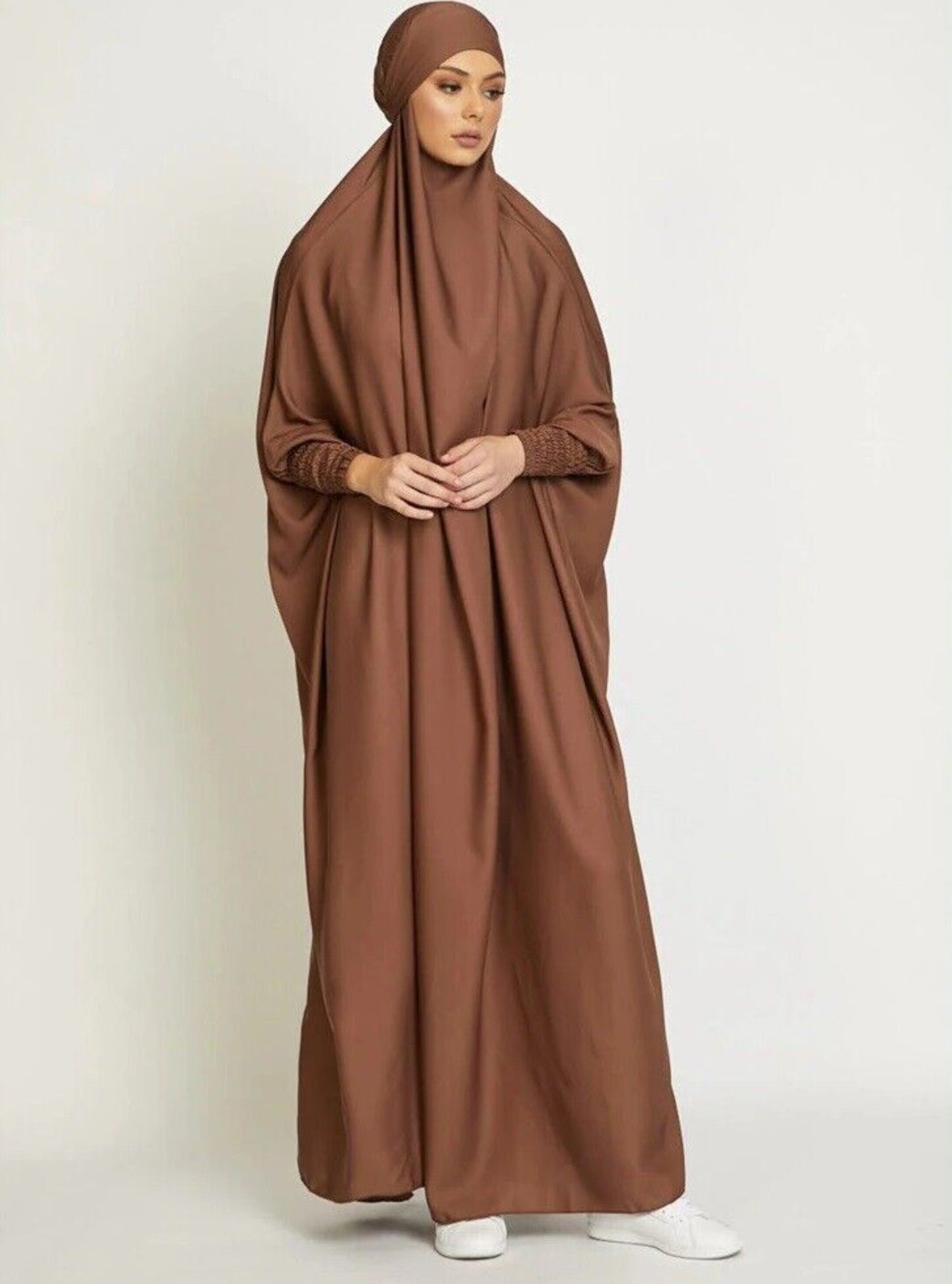 Embrace warmth and elegance with our Coffee One Piece Tie-Up Jilbab. Tailored from premium satin material, this exclusive Islamic garment offers both comfort and opulence. Discover the perfect blend of modesty and style at Hikmah Boutique.