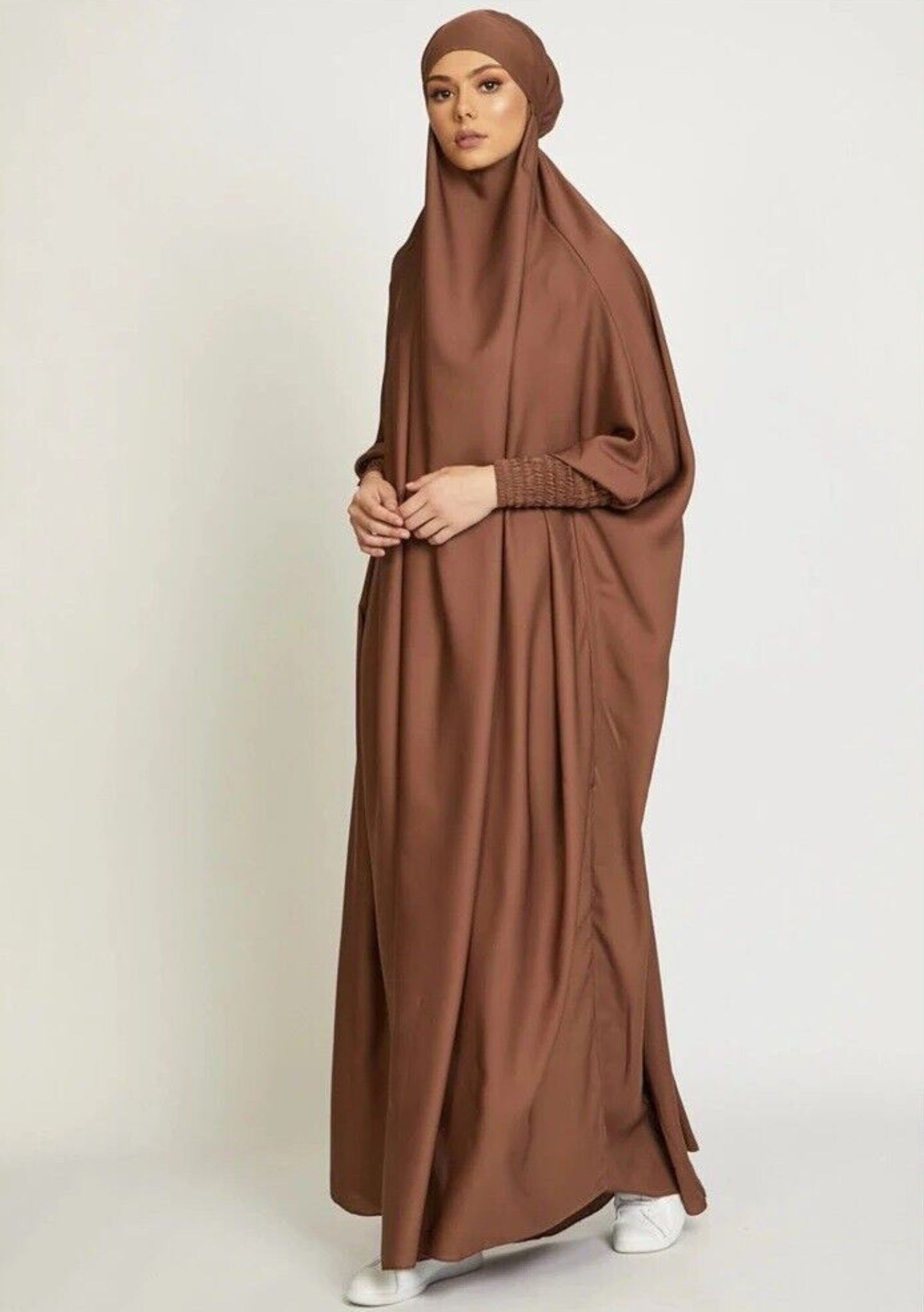 Embrace warmth and elegance with our Coffee One Piece Tie-Up Jilbab. Tailored from premium satin material, this exclusive Islamic garment offers both comfort and opulence. Discover the perfect blend of modesty and style at Hikmah Boutique.