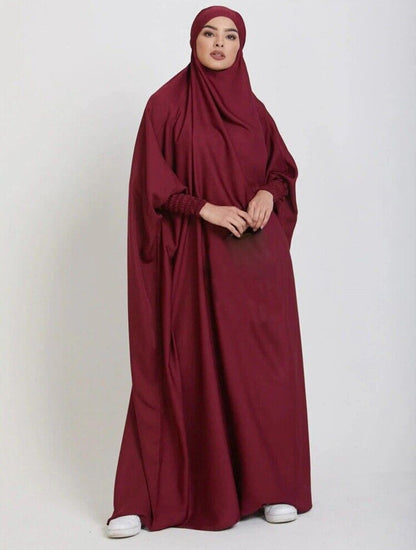 Step into regal elegance with our Maroon One Piece Tie-Up Jilbab. Meticulously designed for confident and beautiful prayer moments, this exclusive Islamic garment combines enduring modesty with opulent style. Explore the regal side of prayer wear at Hikmah Boutique.