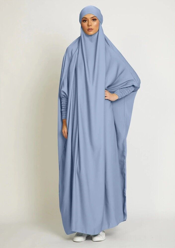 Discover elegance with our Sky Blue Jilbab from Hikmah Boutique. Explore this elegant of one-piece, tie-up satin Jilbab, blending traditional modesty with contemporary style. Shop premium, affordable, and unique Islamic fashion for women. Elevate your wardrobe with chic and comfortable prayer wear today.