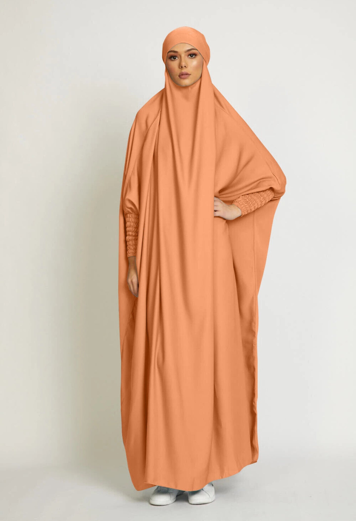 Embark on a journey of vibrant elegance with our Tangerine One Piece Tie-Up Jilbab. Meticulously designed to seamlessly blend modesty with contemporary allure, this exclusive Islamic garment is a captivating dance of grace and comfort, enhancing your sacred moments of devotion.
