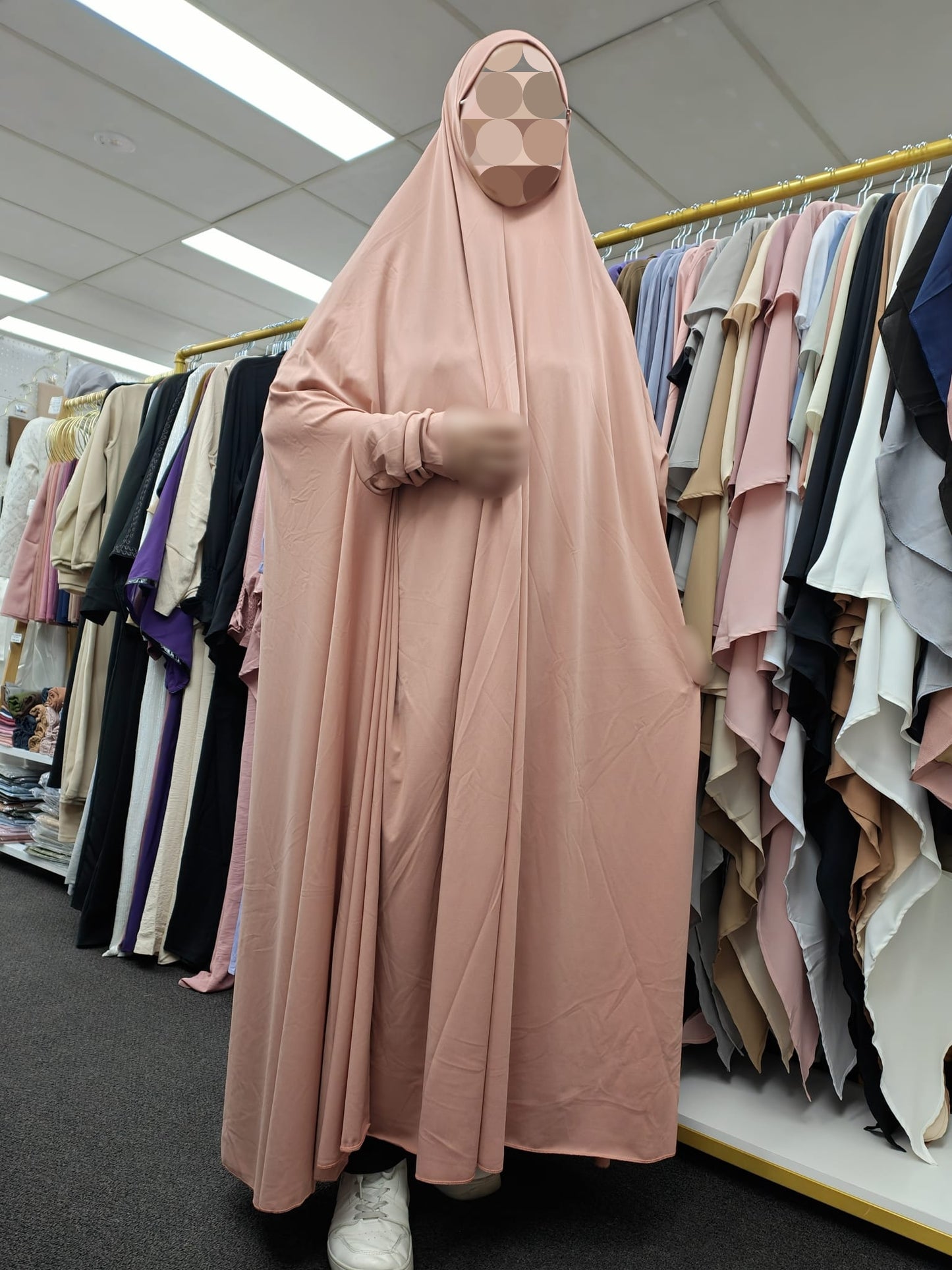 Elevate your modest wear with our Premium Coral Pink Jilbab, crafted from luxurious ITY Knit fabric for exceptional comfort and style. Shop now at Hikmah Boutique for this ankle-length, non-see-through jilbab at a reasonable price.