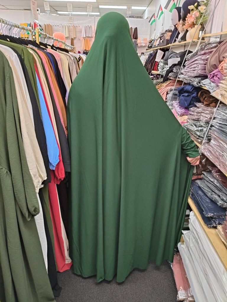 Shop the Premium Ankle Length Jilbab in Forest Green at Hikmah Boutique. Made from ITY Knit Fabric, this modest jilbab is perfect for daily wear. Non-see-through, with effortless sleeves. Available now!