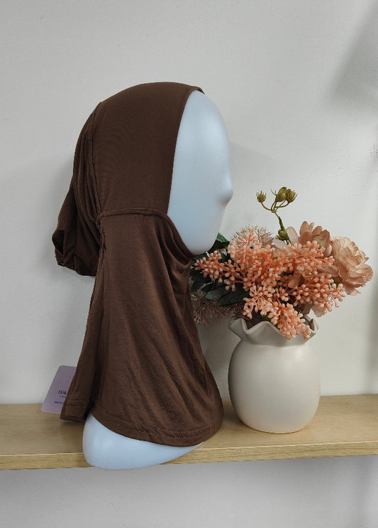 Introducing the Pure Bamboo Hijab Ninja Cap in Brown – the epitome of comfort, elegance, and practicality for every hijab-wearing woman. This cap is meticulously crafted from premium bamboo fabric, making it an essential accessory for those who prioritize both style and sustainability.