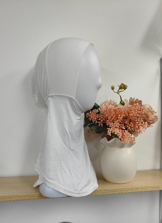 Introducing the Pure Bamboo Hijab Ninja Cap in White, exclusively available at Hikmah Boutique. Crafted with care, this bamboo hijab ninja cap epitomizes softness, style, and sustainability, offering a versatile accessory for the modern Muslimah's wardrobe.