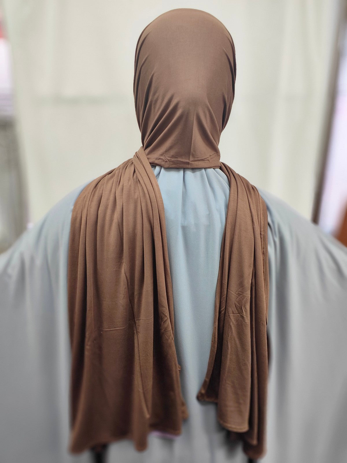 Discover the epitome of elegance and comfort with our Chocolate Brown Pure Bamboo Hijab, exclusively available at Hikmah Boutique. This hijab seamlessly combines style, breathability, and eco-friendliness. Stay cool, confident, and eco-conscious with its natural antibacterial and anti-odor properties. 