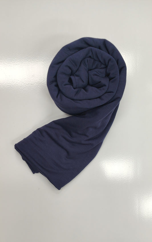 Discover the pinnacle of elegance and comfort with our Dark Navy Pure Bamboo Hijab, exclusively offered by Hikmah Boutique. This hijab seamlessly merges style, breathability, and eco-friendliness, making it the ideal choice for any occasion. Stay cool and confident with Hikmah Boutique's Premium Quality Hijabs.