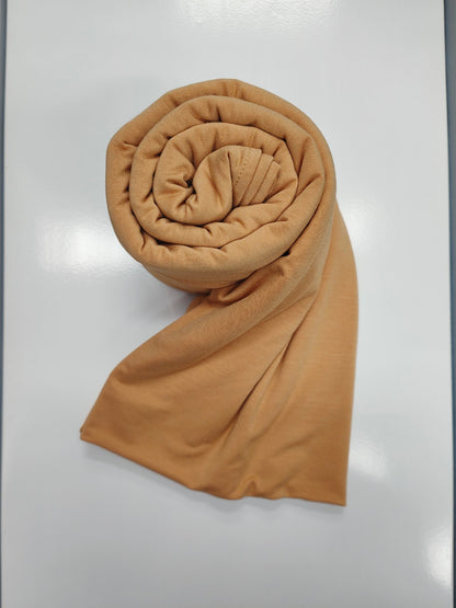 Discover the pinnacle of elegance and comfort with our Desert Sand Pure Bamboo Hijab, exclusively offered by Hikmah Boutique. This hijab seamlessly merges style, breathability, and eco-friendliness, making it the ideal choice for any occasion. Stay cool and confident with Hikmah Boutique's Premium Quality Hijabs.