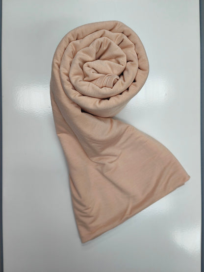 Discover the pinnacle of elegance and comfort with our Nude Pure Bamboo Hijab, exclusively offered by Hikmah Boutique. This hijab seamlessly merges style, breathability, and eco-friendliness, making it the ideal choice for any occasion. Stay cool and confident with Hikmah Boutique's Premium Quality Hijabs.