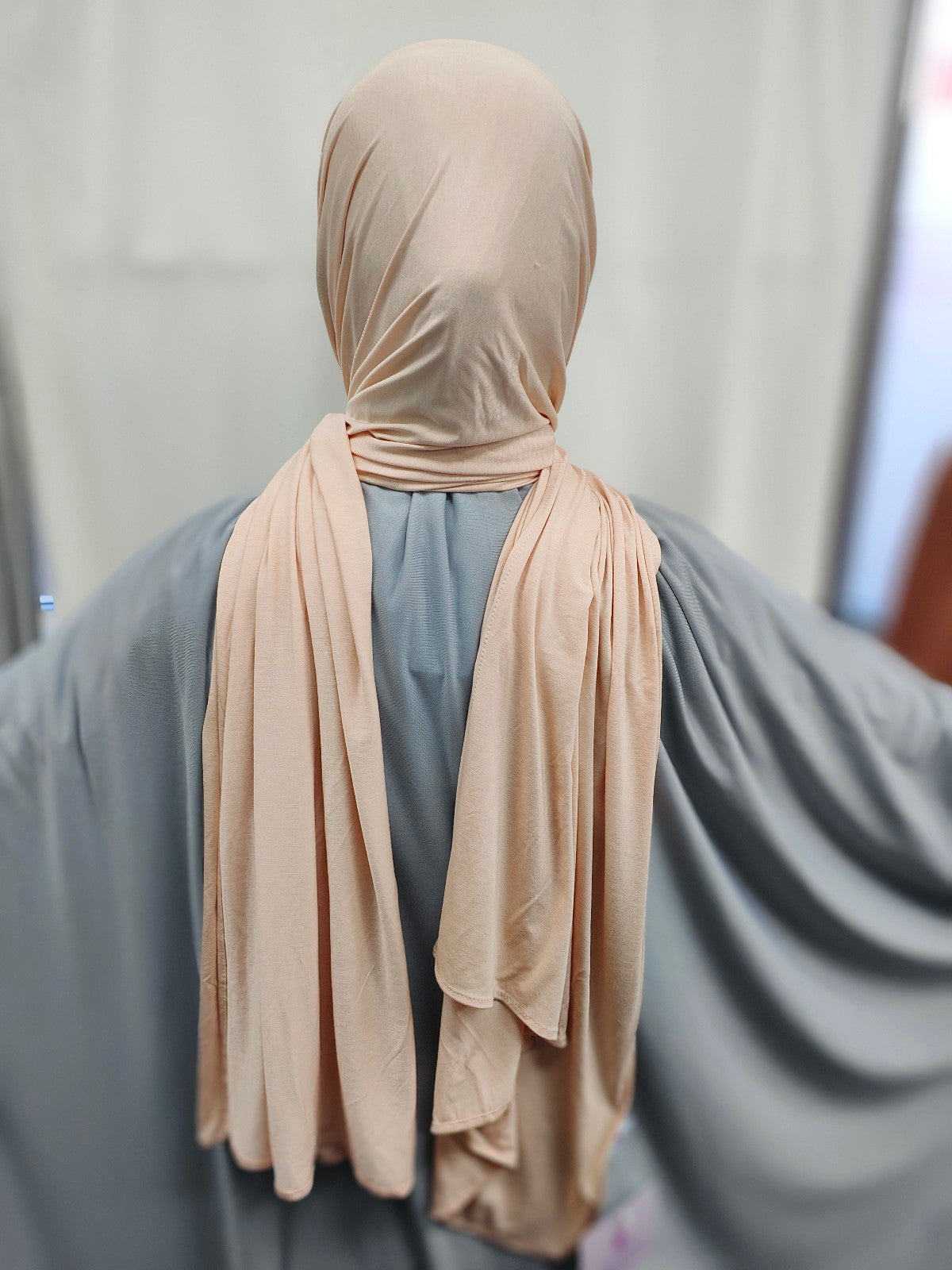 Discover the pinnacle of elegance and comfort with our Nude Pure Bamboo Hijab, exclusively offered by Hikmah Boutique. This hijab seamlessly merges style, breathability, and eco-friendliness, making it the ideal choice for any occasion. Stay cool and confident with Hikmah Boutique's Premium Quality Hijabs.
