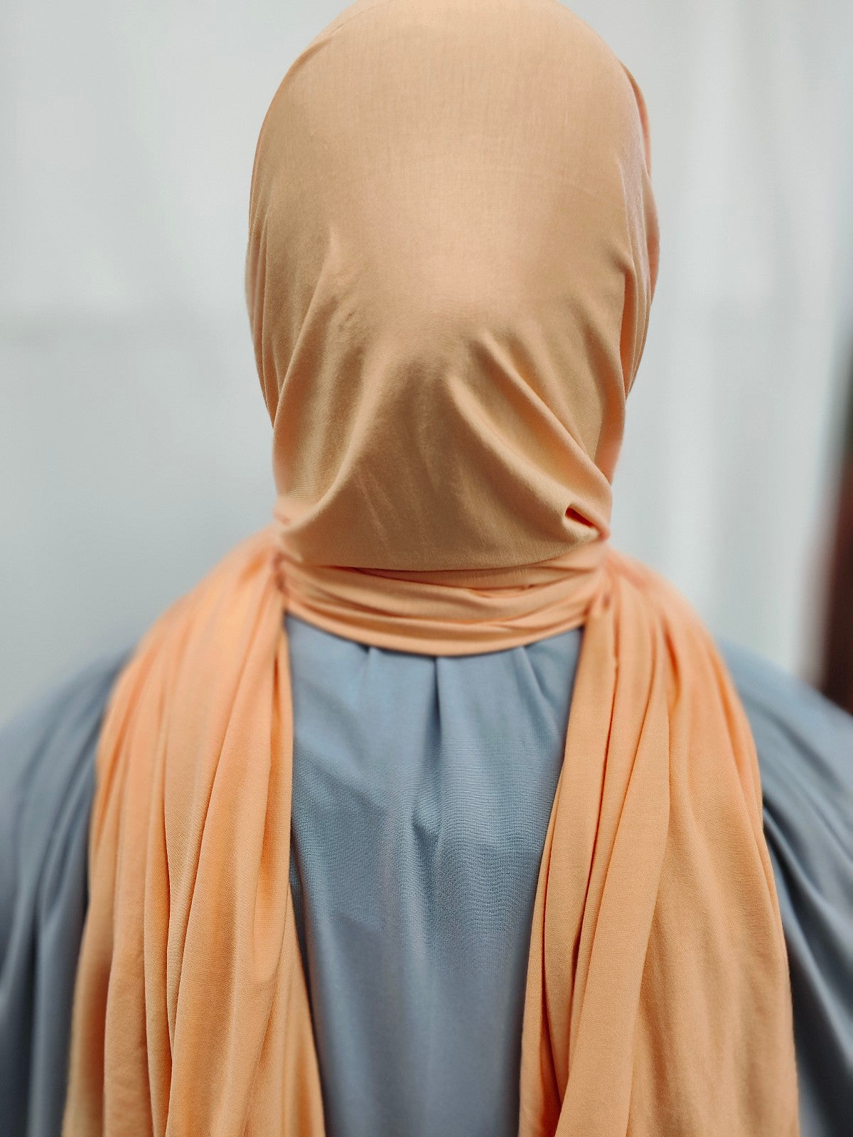 Discover the pinnacle of elegance and comfort with our Tangerine Pure Bamboo Hijab, exclusively offered by Hikmah Boutique. This hijab seamlessly merges style, breathability, and eco-friendliness, making it the ideal choice for any occasion. Stay cool and confident with Hikmah Boutique's Premium Quality Hijabs.