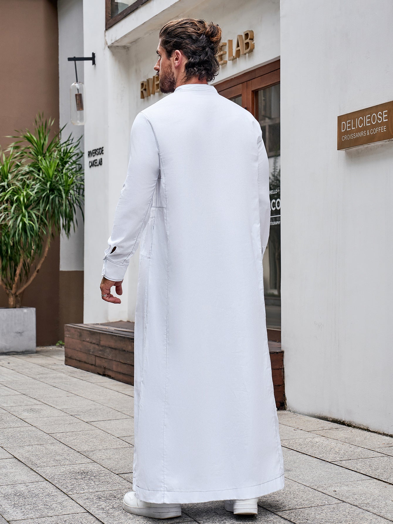 Pure Cotton Saudi White Thobe. This authentic thobe is made from pure cotton fabric and features a standard half collar, long sleeves, chest buttons, and pockets. Shop now at Hikmah Boutique Australia.