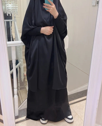 Elevate your modest wardrobe with our premium Satin French Jilbab in Black, exclusively available at Hikmah Boutique. Crafted from luxurious satin material, this two-piece set offers timeless elegance for your prayer attire and beyond. Buy online in Australia and enjoy fast shipping from Hikmah Boutique.