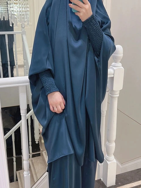 Elevate your modest wardrobe with our exquisite Dusty Royal Blue Satin French Jilbab. Crafted with premium satin material, this two-piece set offers elegance and comfort. Shop now at Hikmah Boutique Australia!