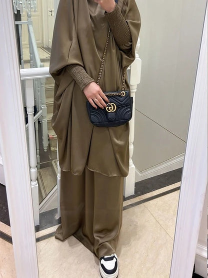 Elevate your modest wardrobe with our Satin French Jilbab in Sandstone, exclusively available at Hikmah Boutique. Made from premium satin material, this two-piece set offers elegance and sophistication for any occasion. Shop now!
