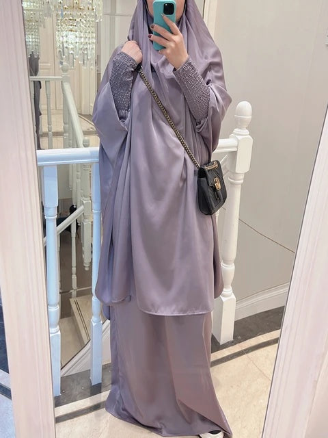 Elevate your modest clothing with our premium Silver Grey Satin French Jilbab exclusively available at Hikmah Boutique. Crafted with exquisite detail, this two-piece set offers timeless elegance and comfort. Shop online in Australia for French Jilbabs and more.