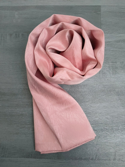 Experience timeless elegance with our Blossom Pink Satin Hijab. Expertly crafted from premium satin, this hijab exudes sophistication and style. The lustrous fabric drapes beautifully, perfect for formal events or everyday wear. Elevate your look with Hikmah Boutique's exclusive hijab collection.
