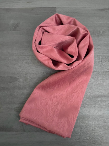 Elevate your style with Hikmah Boutique's Satin Hijab in Dark Pink. Discover luxury satin hijab styles for special occasions and everyday wear. Buy the best satin hijabs online that combine affordability with premium quality.