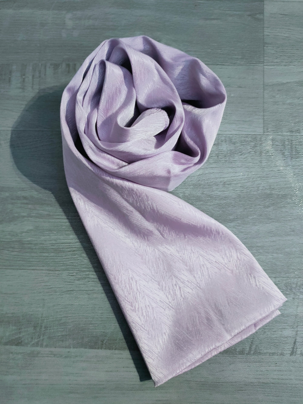Experience luxurious elegance of Satin Hijab in Lilac by Hikmah Boutique. Crafted from premium satin, this hijab exudes sophistication and style. The soft and lustrous fabric drapes beautifully, making it perfect for formal events or daily wear. Embrace timeless charm with Hikmah Boutique.