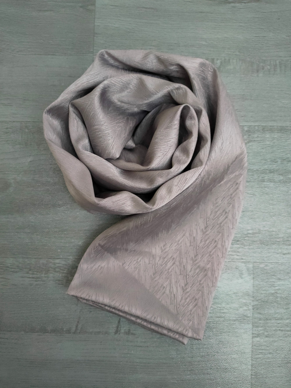 Discover elegance with our Space Grey Satin Hijab. Crafted from premium satin, exuding sophistication. These Satin Hijabs are perfect for formal occasions or daily wear. Explore the best satin hijabs online, perfect for special occasions. Premium quality and trendy designs at Hikmah Boutique.