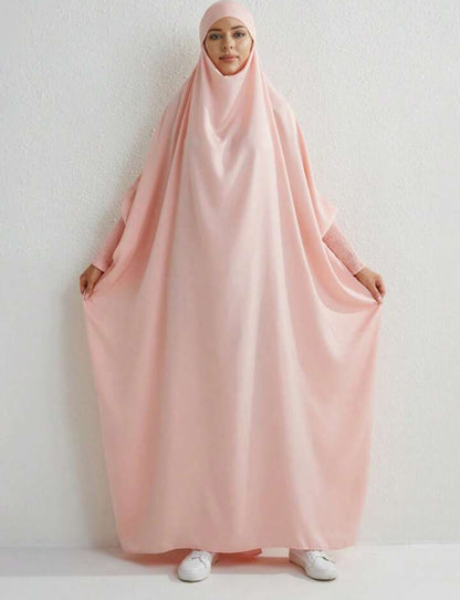 Introducing the epitome of regal elegance - the Satin Jilbab in Blossom Pink, exclusively offered by Hikmah Boutique. Envelop yourself in luxurious satin fabric, meticulously tailored to perfection, promising an unparalleled experience of grace and sophistication fit for royalty.