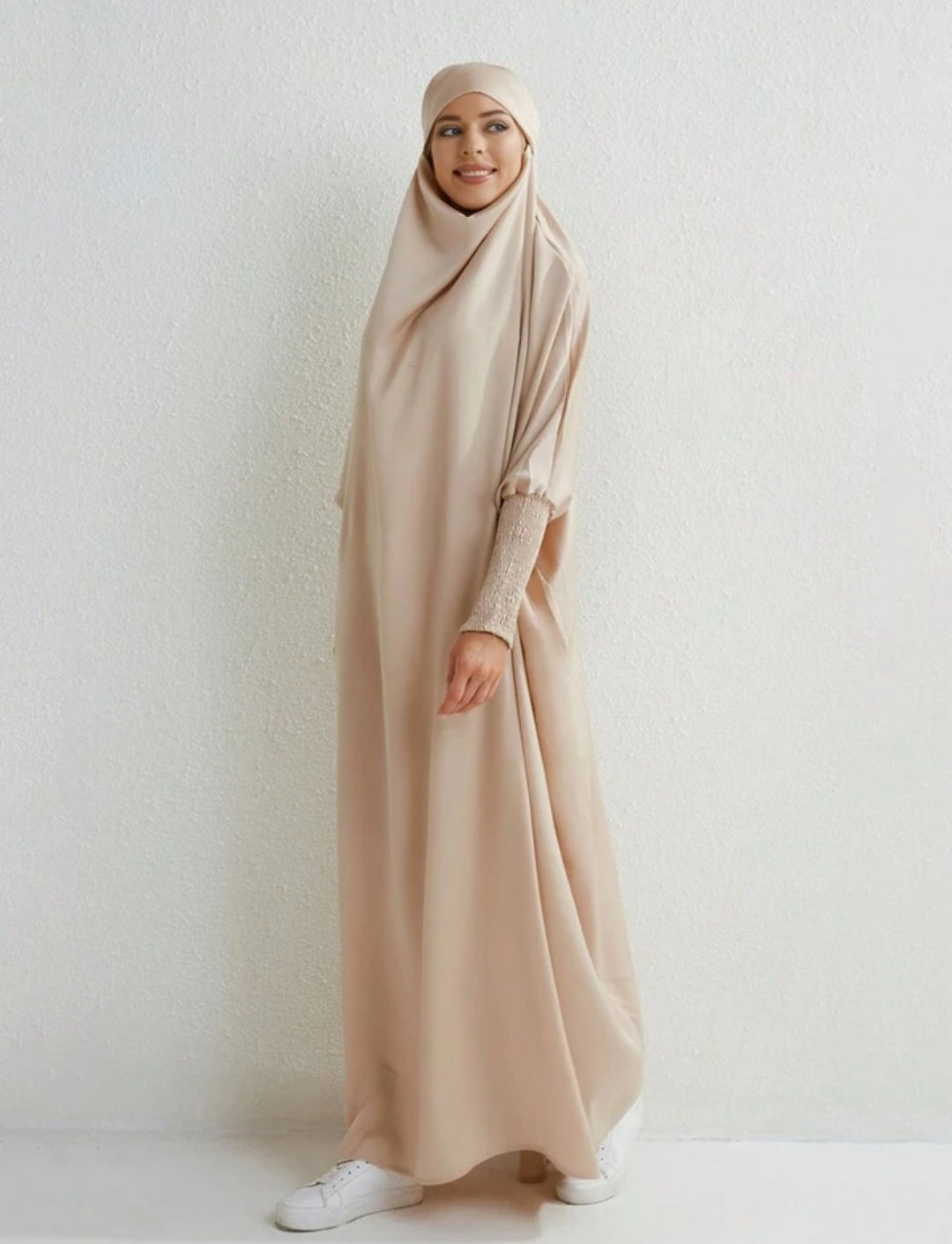 Introducing the epitome of refined modesty and timeless sophistication - the Satin Jilbab in Cream Beige, exclusively offered by Hikmah Boutique. Immerse yourself in the luxurious embrace of satin fabric meticulously tailored to perfection, promising an unparalleled experience of grace and elegance. 
