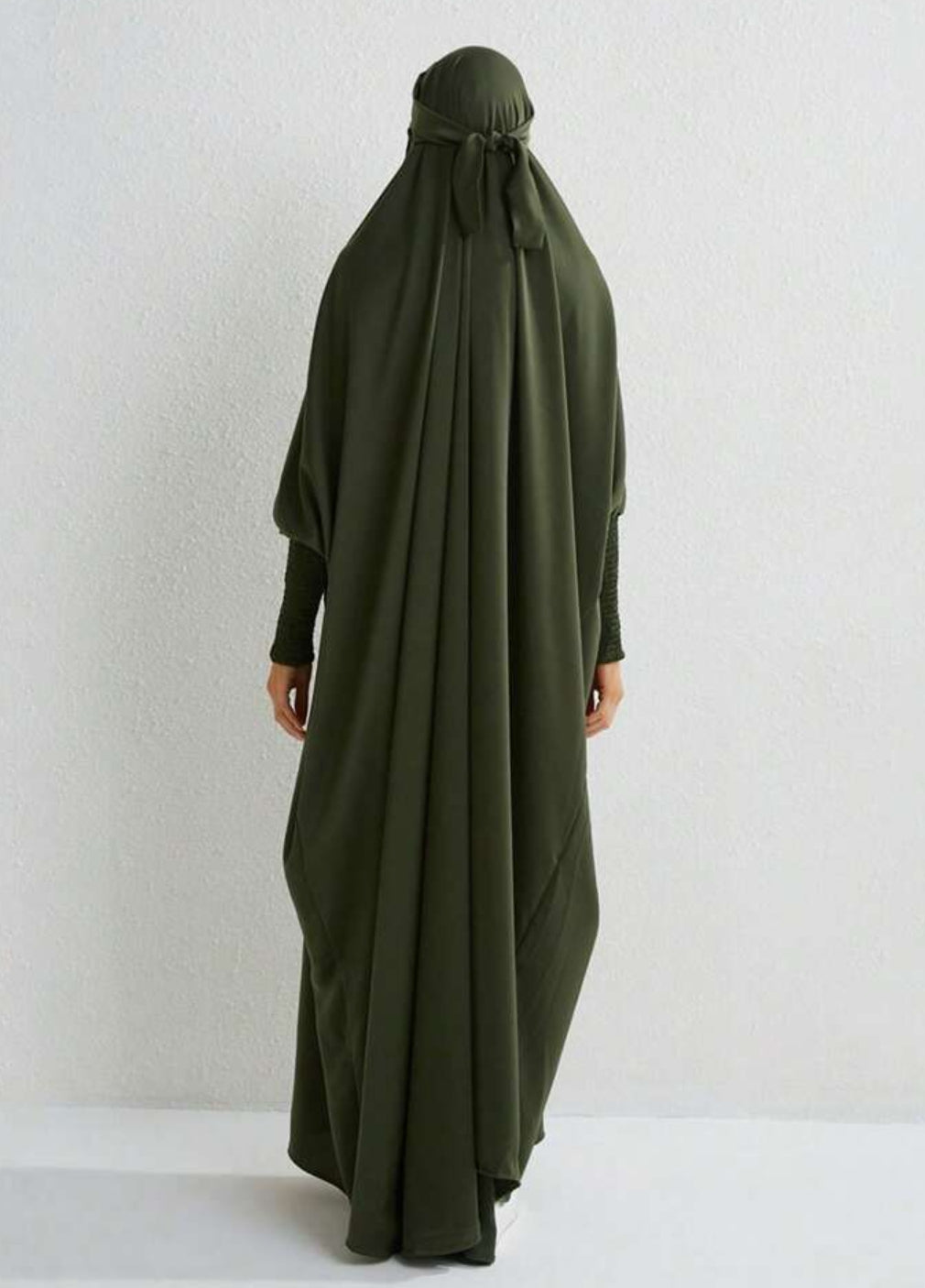 Introducing the epitome of elegance and sophistication - the Satin Jilbab in Olive Green, exclusively available at Hikmah Boutique. Crafted with meticulous attention to detail, this exquisite one-piece tie back satin jilbab is designed to elevate your modest wardrobe to new heights. 