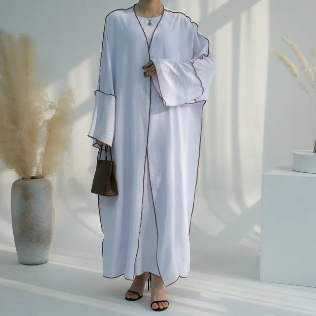 Modest elegance and comfort with Summer Abaya 2-Piece Set in White, exclusively available at Hikmah Boutique. This Modest Abaya set is crafted to keep you cool in Umrah.